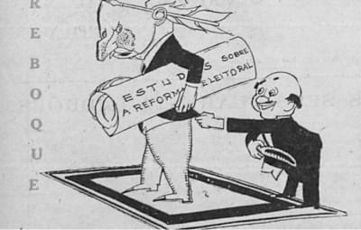 Imagem 2.5-editado.jpg com a legenda <em>Charge da revista O Malho ironiza a demora de Assis Brasil para concluir os estudos sobre a reforma eleitoral,</em> 20/6/1931. <br> <strong>Biblioteca Nacional</strong>